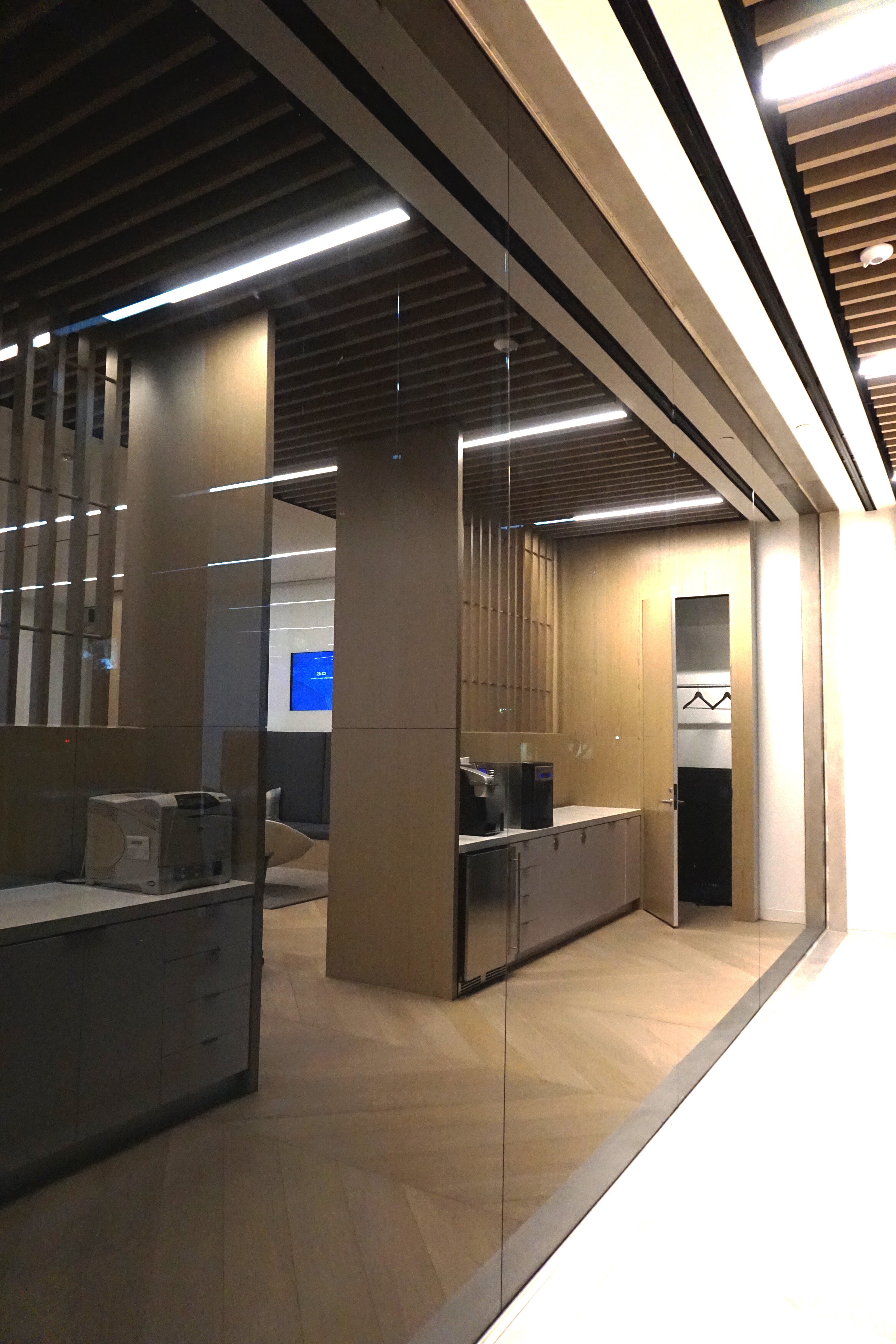 Modern office lobby with glass walls and sleek design.